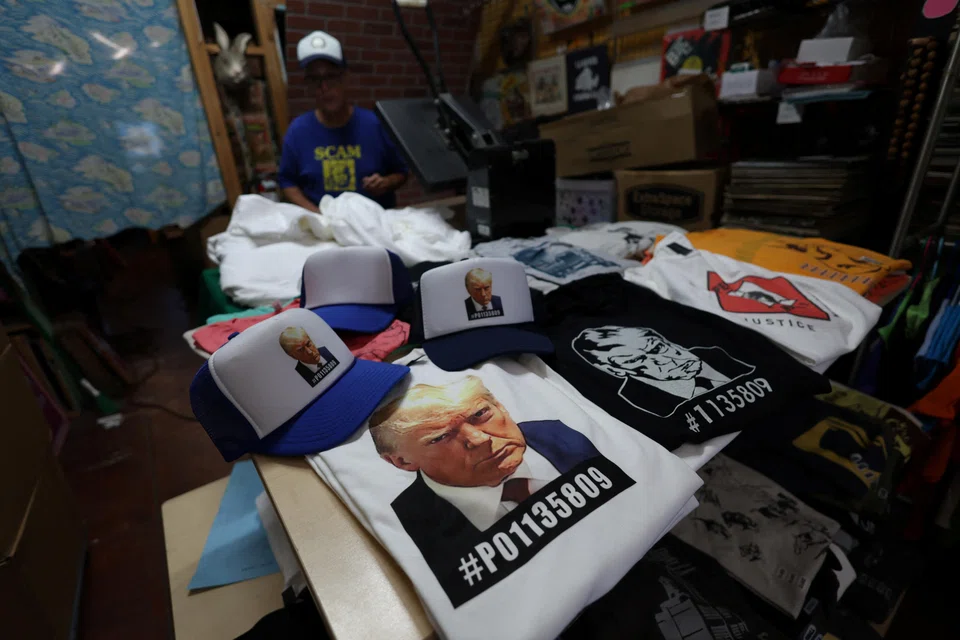 Donald Trump's mug shot, posted by a Georgia courthouse on Thursday evening, has been turned into T-shirts, shot glasses, mugs, posters and even bobblehead dolls by friends and foes alike.