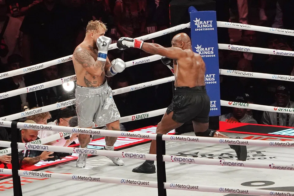 Jake Paul (left) of the United States in action against Mike Tyson (right) of the United States during their heavyweight bout, Arlington, Texas, Nov 15, 2024.  