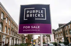 A sign for online estate agent Purplebricks is pictured outside a property in a residential street in London. According to agents and consultants of both buyers and sellers, quality apartments and houses in London and the south of England are in short supply.