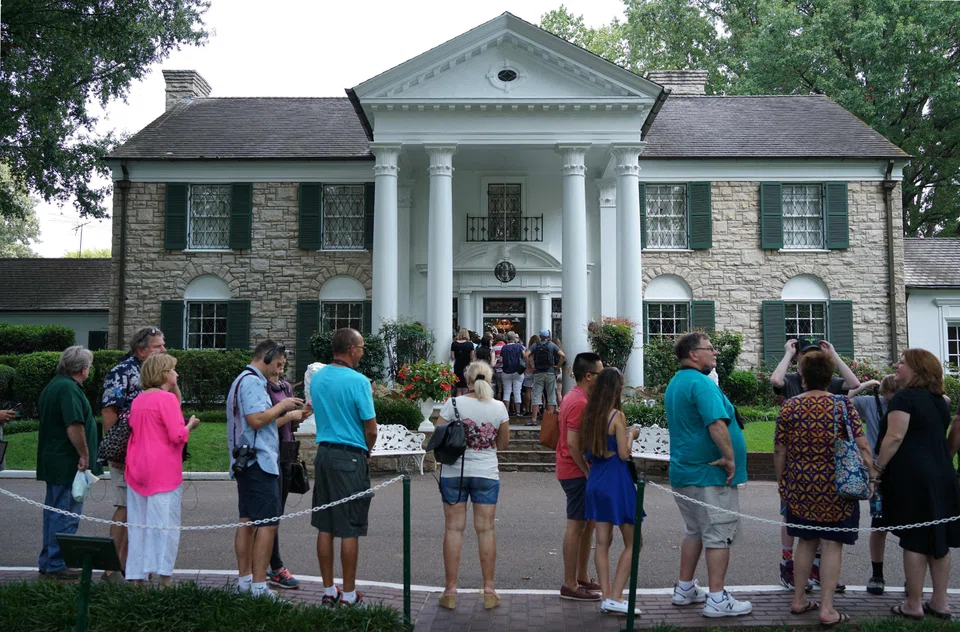 Visitors queue to enter the Graceland Mansion of Elvis Presley in Memphis, Tennessee, Aug 12, 2017. Lisa Jeanine Findley had falsely claimed that Elvis’s only child, Lisa Marie Presley, had pledged the historic landmark as collateral for a loan that she failed to repay before her death.