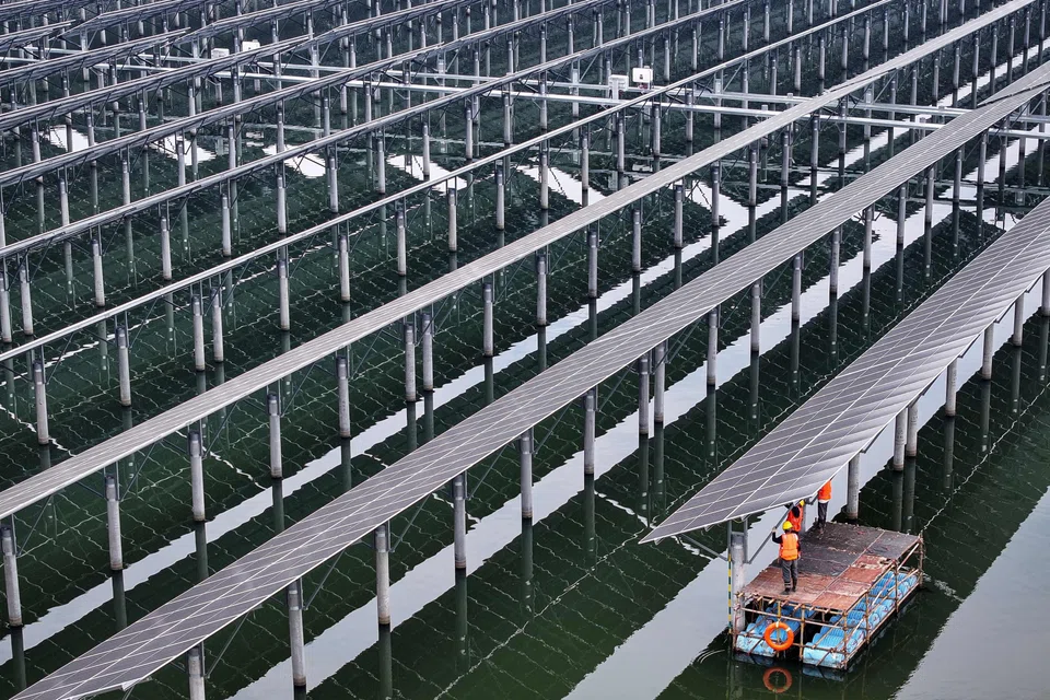 Solar panels being installed at a fishing-solar complementary PV power-generation base in Rudong, China.  Recent political developments have injected volatility into the solar sector.