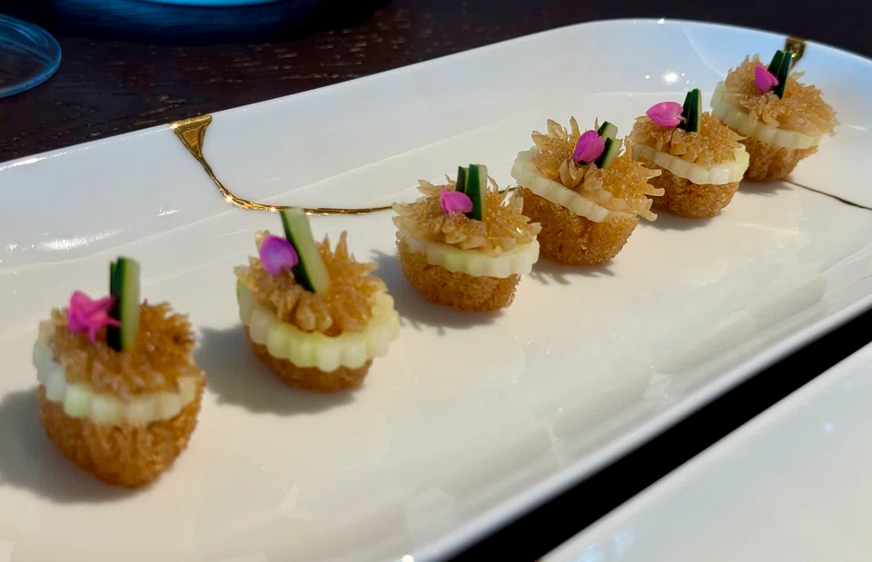 Marinated jellyfish shaped like chrysanthemum flowers.