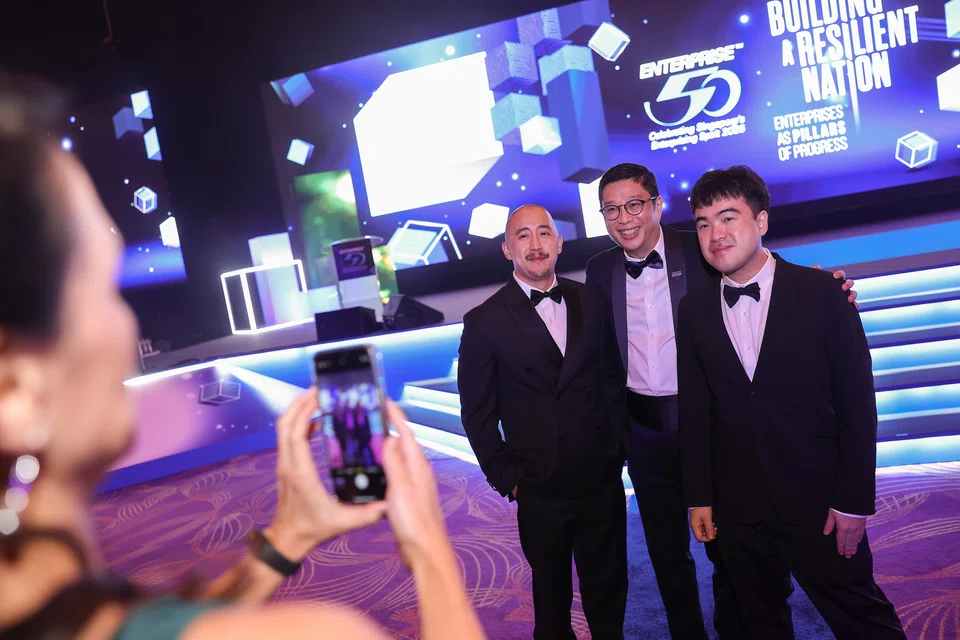 One for the album...from far left: Jonathan Wong, CEO of Prism Tech; Brandon Lim, director, private enterprise, KPMG in Singapore; and Jonathan Tan, MD of Prism Tech. 