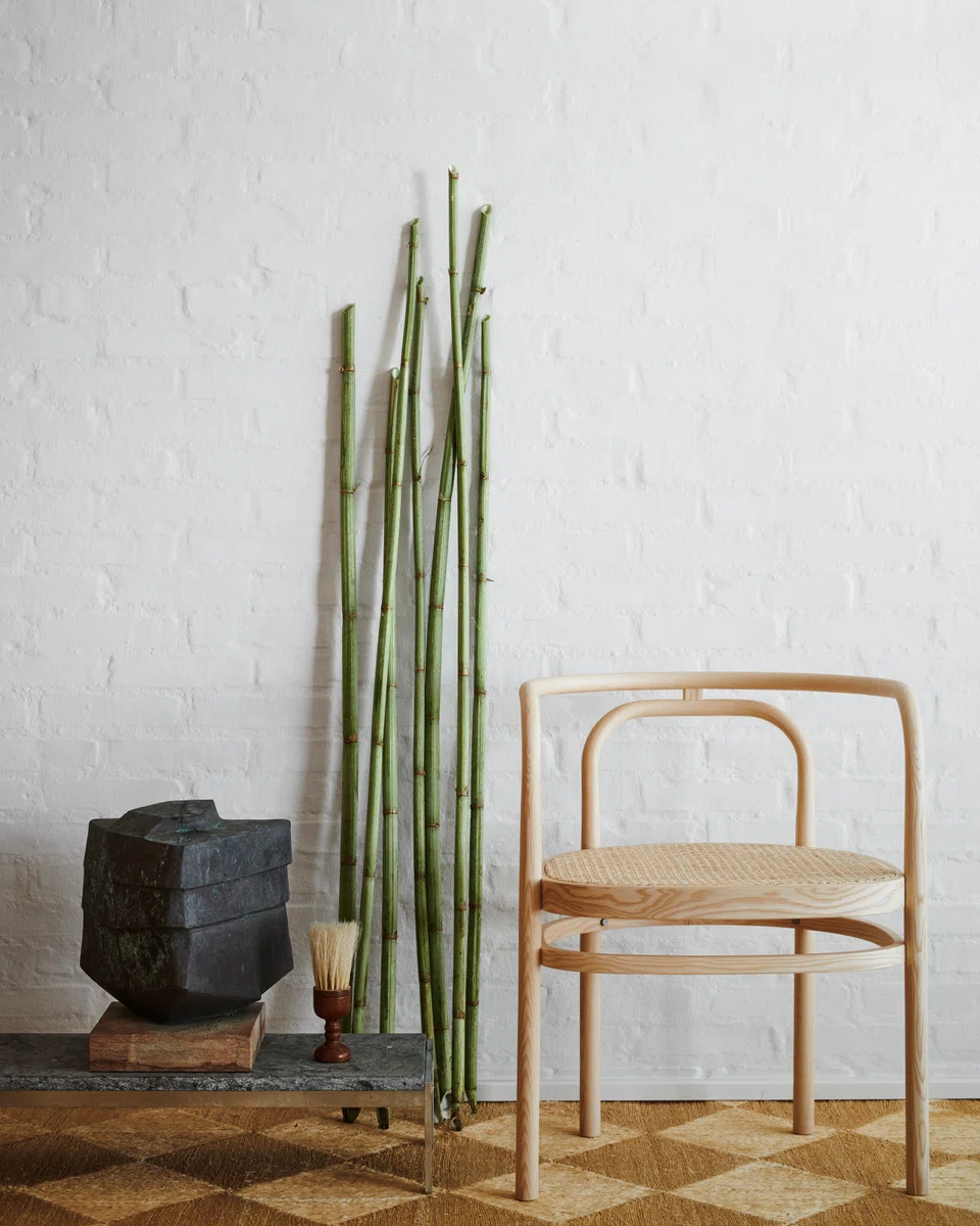 A PK15™ chair and PK62TM coffee table.