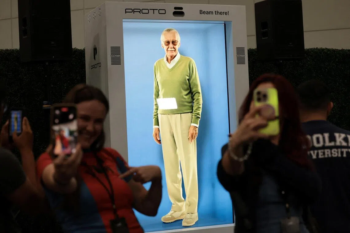 Fans can interact with a hologram of Stan Lee in an enclosed booth at the Los Angeles Convention Center.