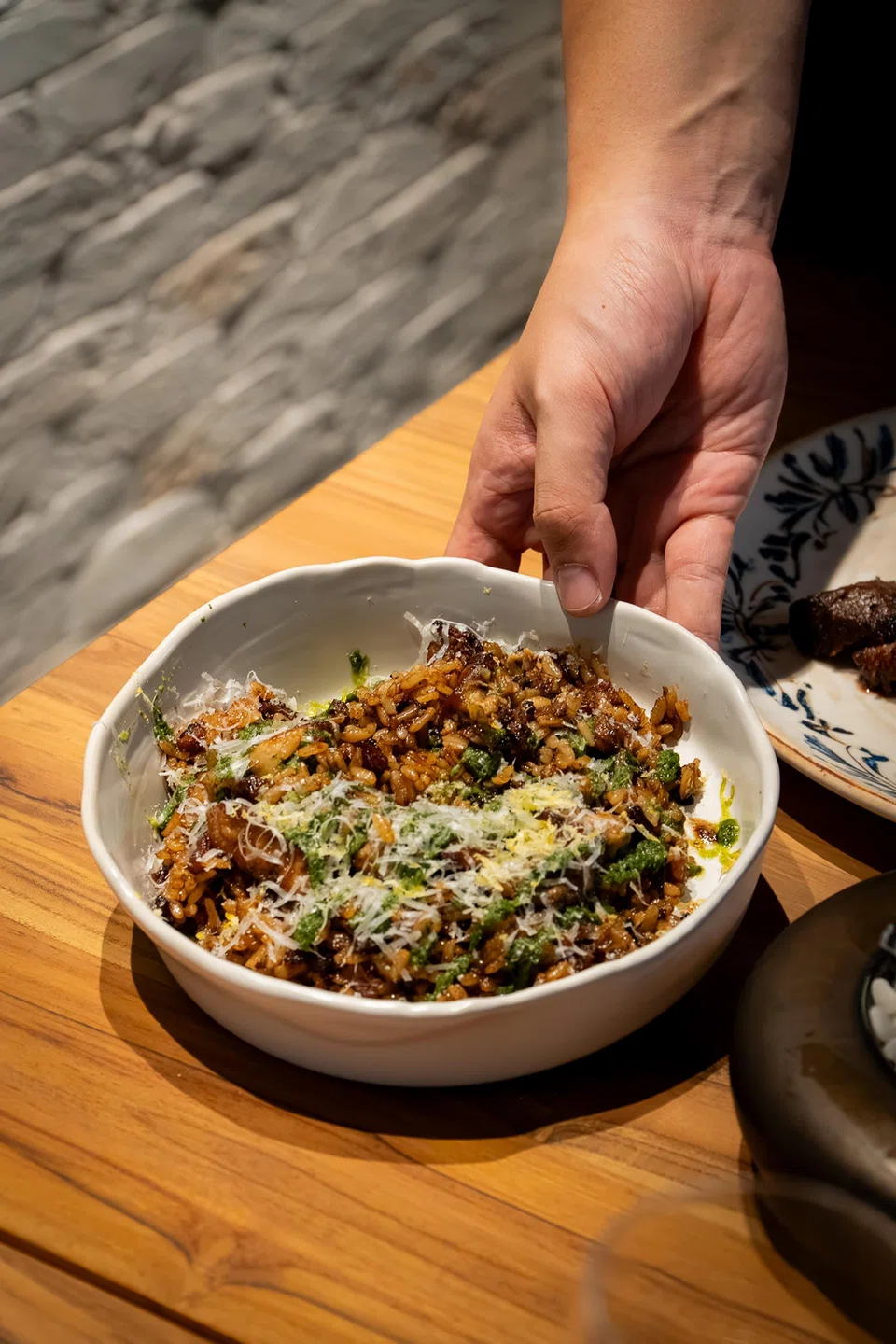 Foie gras dirty rice is a cross between risotto and fried rice.