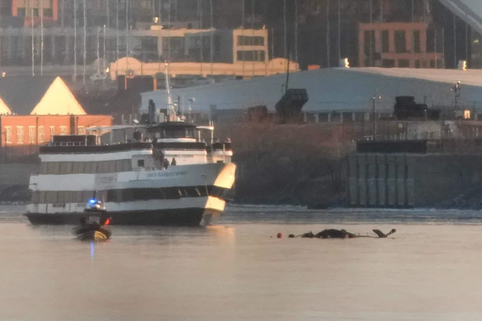 Emergency response units search the crash site of the American Airlines plane on the Potomac River after the plane crashed on approach to Reagan National Airport, Arlington, Virginia, Jan 30, 2025.
