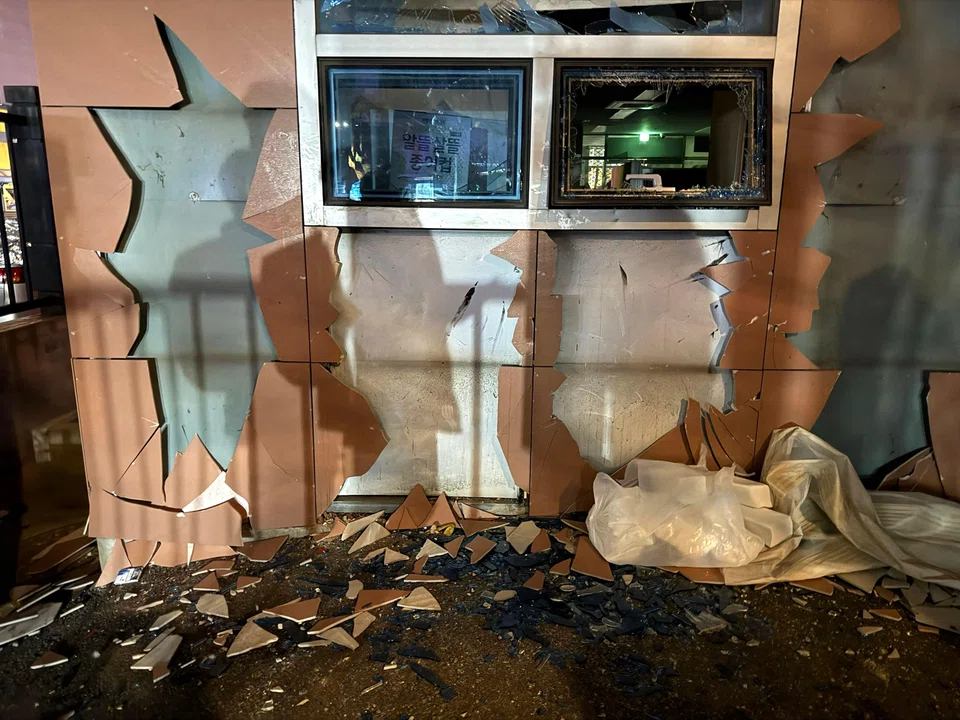 Angry Yoon supporters stormed the Seoul Western District Court building (top) early on Sunday, destroying property and clashing with police.