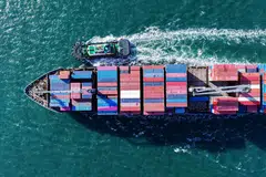A container ship approaching a port in Qingdao, China. The tariffs imposed on China are unsurprising, those on smaller Asean countries came as a shock.  