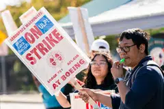 Workers picket outside the Boeing. manufacturing facility during a strike in Renton, Washington, Oct 3, 2024. 