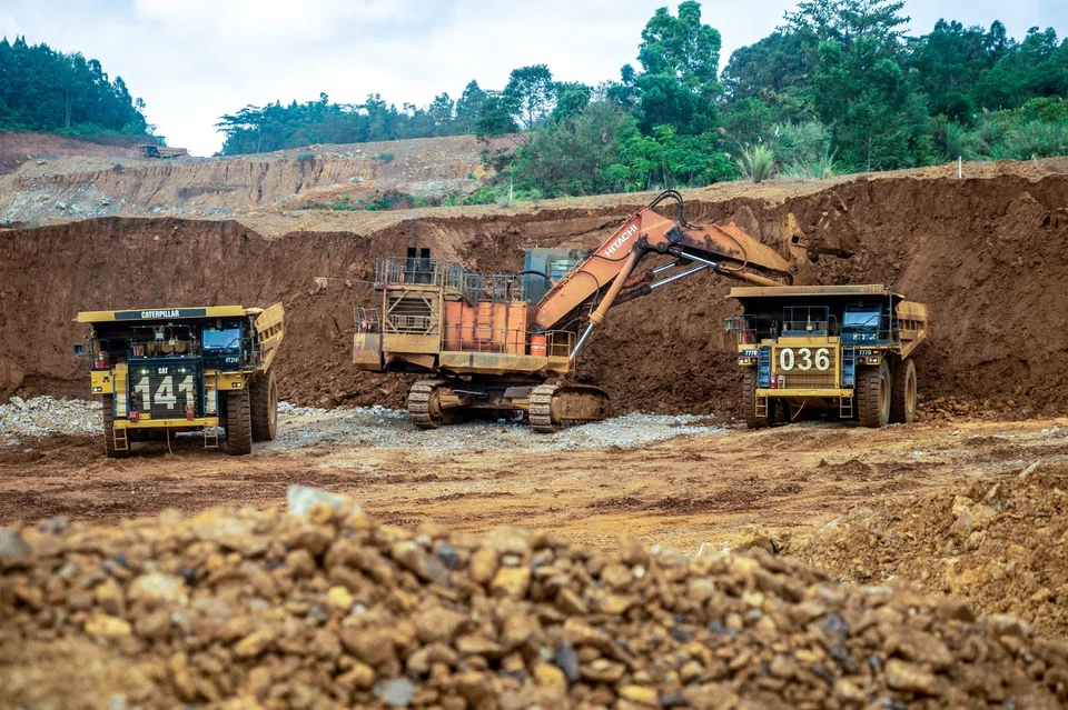 Excavators transferring soil to transport trucks at a nickel mine operated by nickel mining company Vale Indonesia in Sorowako on July 28, 2023. Government-backed Vale Indonesia aims to raise production to up to 70,800 tonnes. 