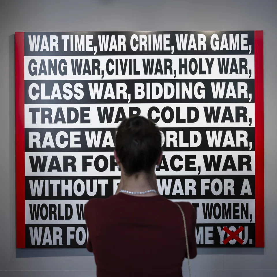 The artwork 'War Time, War Crime' (2025) by American artist Barbara Kruger is on display at the preview of Art Basel 2025.