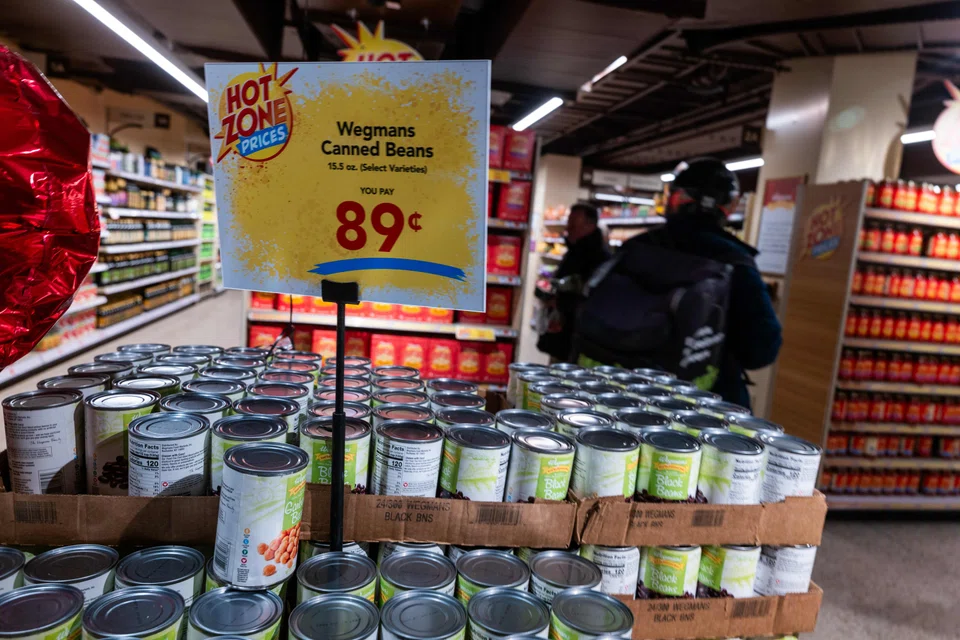 Canned soup and vegetables in a grocery store in New York City. President Donald Trump's 25% tariff on all steel and aluminium imports into the US could result in higher prices of consumer goods that use the metals, say economists.