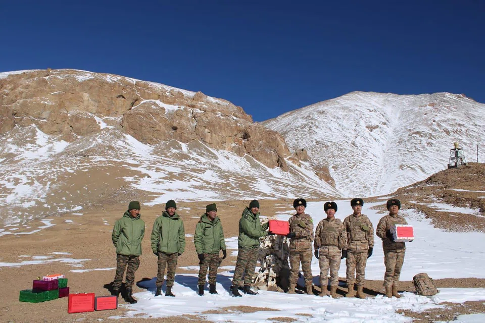 Indian and Chinese army greet each other along the Line of Actual Control (LAC) near Karakoram pass in Ladakh.