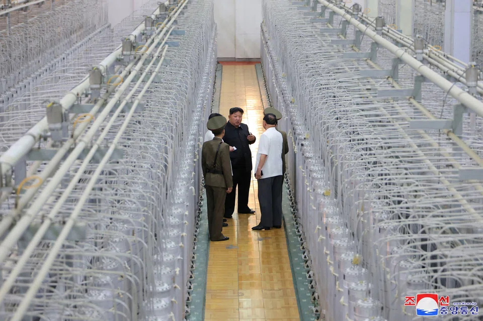 North Korean leader Kim Jong Un (centre) inspecting the production of weapon-grade nuclear materials at an undisclosed location in North Korea.