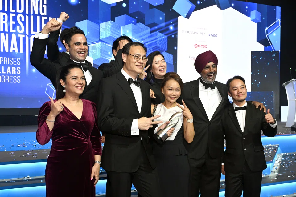 Arsh Chaudhry (wearing a turban), CEO of Space Matrix with his team after winning an E50 award.