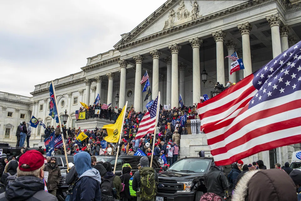 Supporters of President Donald Trump storm the US Capitol in Washington, US, Jan 6, 2021. Judge Tanya Chutkan made public portions of a filing by prosecutors setting out their argument for why the case should go forward despite the Supreme Court's ruling on presidential immunity.
