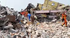 Specialists, including members of Russia's emergencies ministry, take part in a search operation following a massive earthquake in Mandalay, Myanmar, April 1, 2025. 