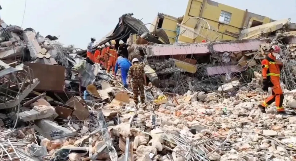 Specialists, including members of Russia's emergencies ministry, take part in a search operation following a massive earthquake in Mandalay, Myanmar, April 1, 2025. 