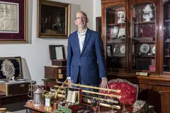 Dr Douglas Arbittier with items from his large collection of medical antiques in Mendham, New Jersey, May 16, 2024. When he found that many medical-themed woodblocks he bought were fake, he began an intense effort to catch the forger. 