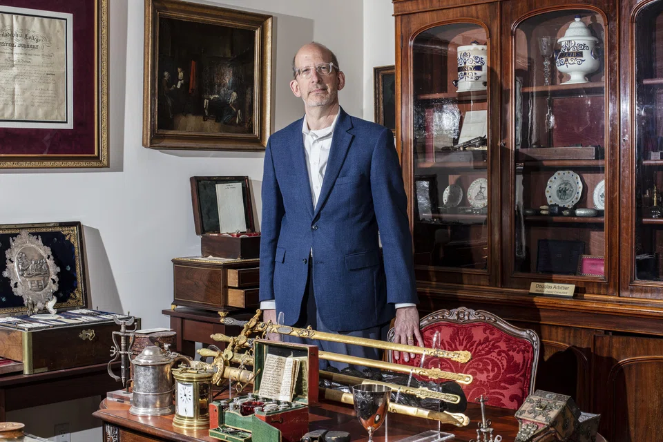 Dr Douglas Arbittier with items from his large collection of medical antiques in Mendham, New Jersey, May 16, 2024. When he found that many medical-themed woodblocks he bought were fake, he began an intense effort to catch the forger. 