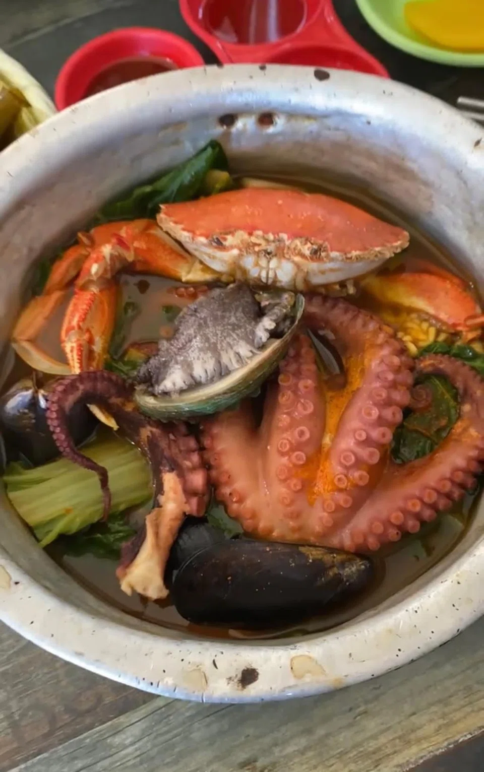 Decadent seafood ramyeon is filled with a whole crab, mussels, abalone and small octopus.