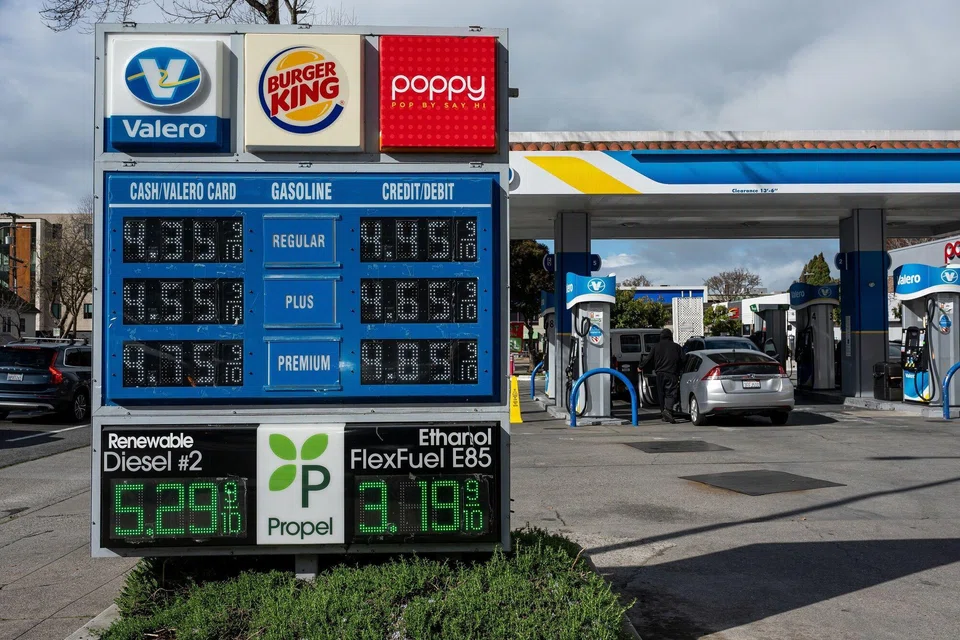 Above: A sign displaying the prices at a petrol station in the US. Oil prices spiked more than 10% on Monday (Mar 2), a clear expression of concern about access to global energy supplies. 
