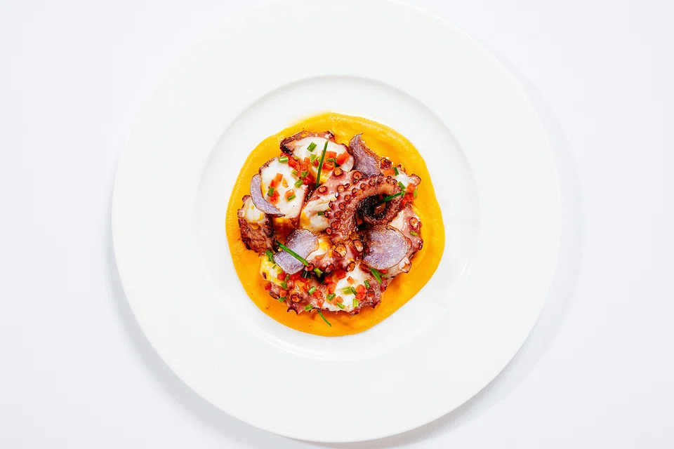 Roasted octopus with potatoes.