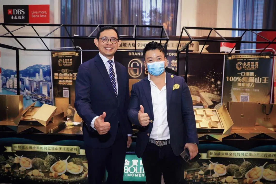In the lead-up to the Mid-Autumn Festival in September, Golden Moments founder Josiah Seow (right) officially launched the Mao Shan Wang durian snowskin mooncakes in China last August at an offline event. Guangzhou-based Singapore consulate-general Loh Tuck Keat (left) was among the attendees at the event, held in Shenzhen.