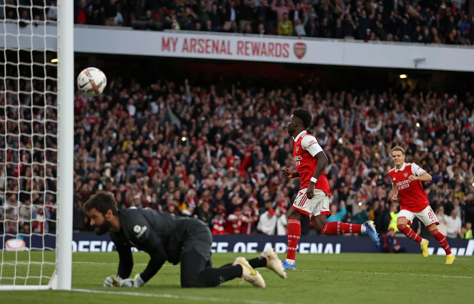 Arsenal's English midfielder Bukayo Saka celebrates scoring the team's third goal from the penalty spot during the EPL football match between Arsenal and Liverpool at the Emirates Stadium in London, Oct 9, 2022. 
