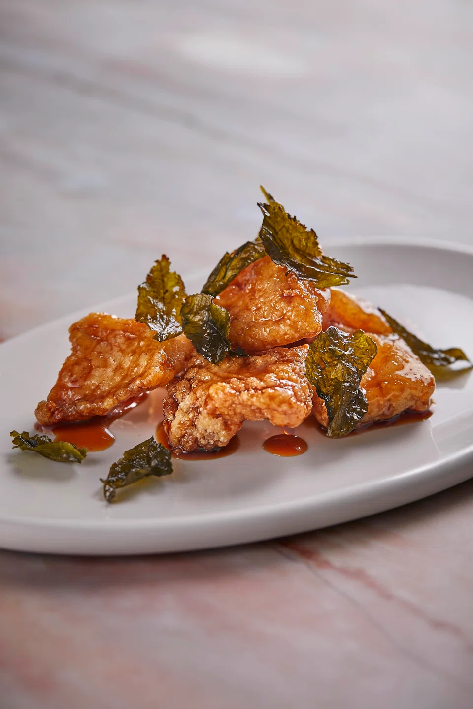 Sweet-sour crispy deep-fried cod fillet.