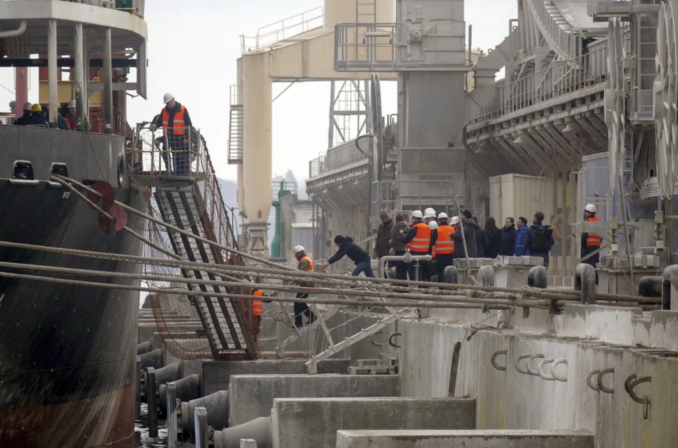 Workers load wheat onto the bulk carrier Valsamitis at the Black Sea port of Chornomorsk near Odessa, Ukraine. Shipping in the Black Sea came under attack in the early weeks of the war in Ukraine, but an agreement brokered by the United Nations has enabled shipping to resume.