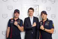 Oracle Red Bull Racing team members Max Verstappen (left) and Sergio Perez (right), with Tag Heuer CEO Frederic Arnault, at the launch of the Monaco Chronograh Night Driver.