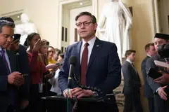 US House Speaker Mike Johnson (centre) speaks to the media after the spending bill was passed in the House of Representatives at the US Capitol in Washington, D.C., Feb 25, 2025. 