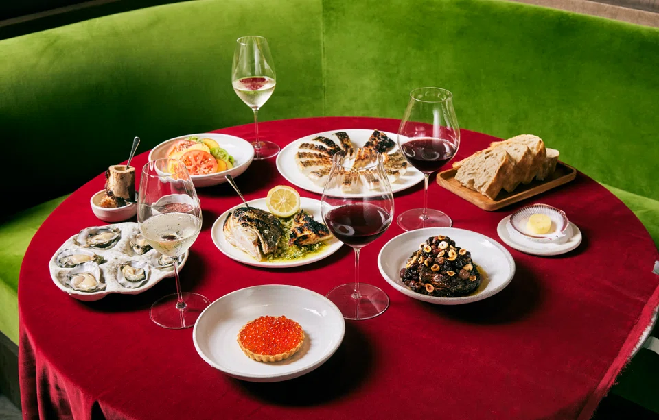 A Christmas dinner of grilled Aquna Murray cod with smoked eel gremolata, oxheart tomato salad and radicchio with cherries and hazelnuts. FYSH egg tart and oysters are from the restaurant menu.
