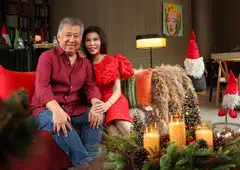 Architect Rene Tan and banker Chuah Woei Woei share a quiet moment in their Christmas-ready home.