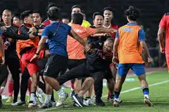 A fight breaks out on the sidelines of the men's football final match between Thailand and Indonesia during the 32nd SEA Games in Phnom Penh, May 16, 2023. 