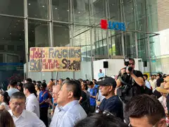 Attendees at Tuesday's lunchtime rally, held at UOB Plaza's promenade.