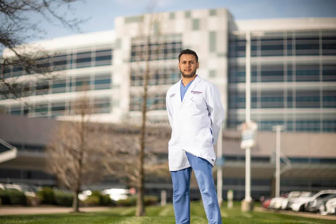 Faysal Alghoula, a pulmonologist from Libya who treats patients in an underserved area, outside of Deaconess Gateway Hospital in Newburgh, Indiana, March 31, 2026.