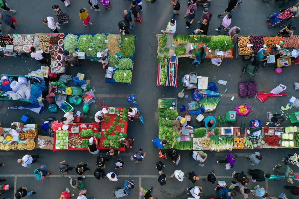 An aerial view of people at a market in Shenyang, in China's northeastern Liaoning province, on Aug 9.