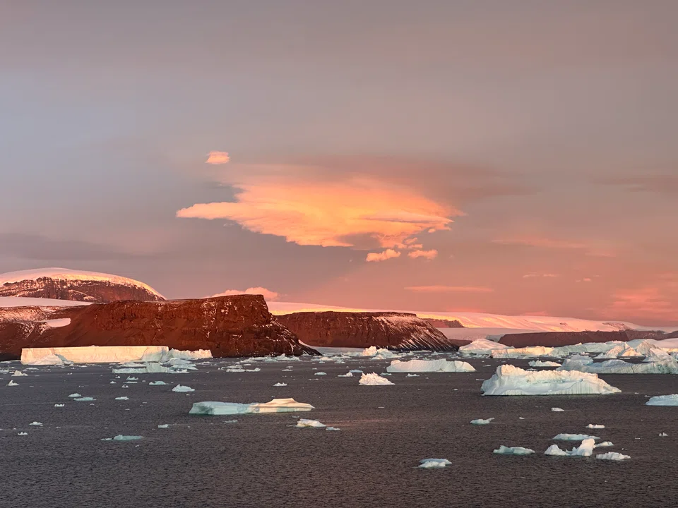 Majestic sunsets add allure to wintry seascapes of the Antarctic.