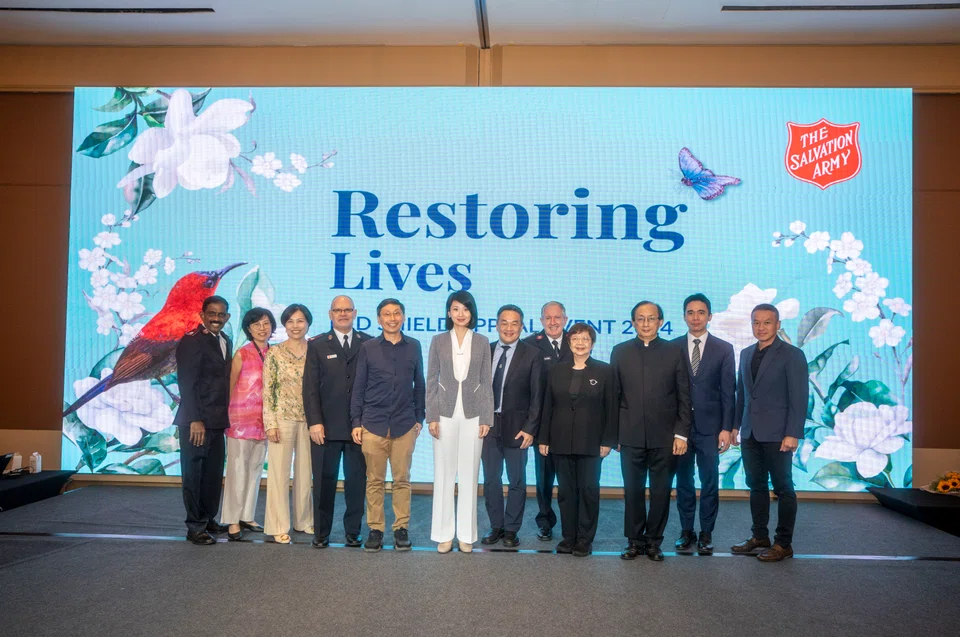 Minister for Social and Family Development and Home Affairs Sun Xueling (sixth from left) with Salvation Army board members at the luncheon.