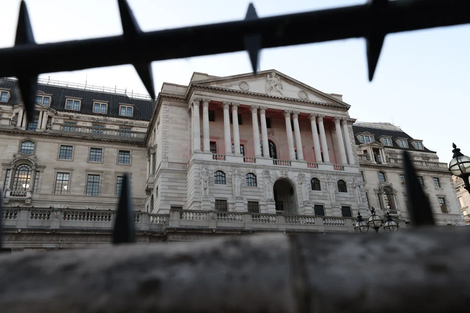The Bank of England in the City of London. The central bank forecasts a protracted recession that will last as long as 15 months, causing the UK economy to shrink by 2.1 per cent during that time.