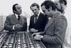 An archival photo of Jack Heuer (left) with F1 drivers Nicky Lauda (middle) and Clay Reggazoni (right) from the 1970s.