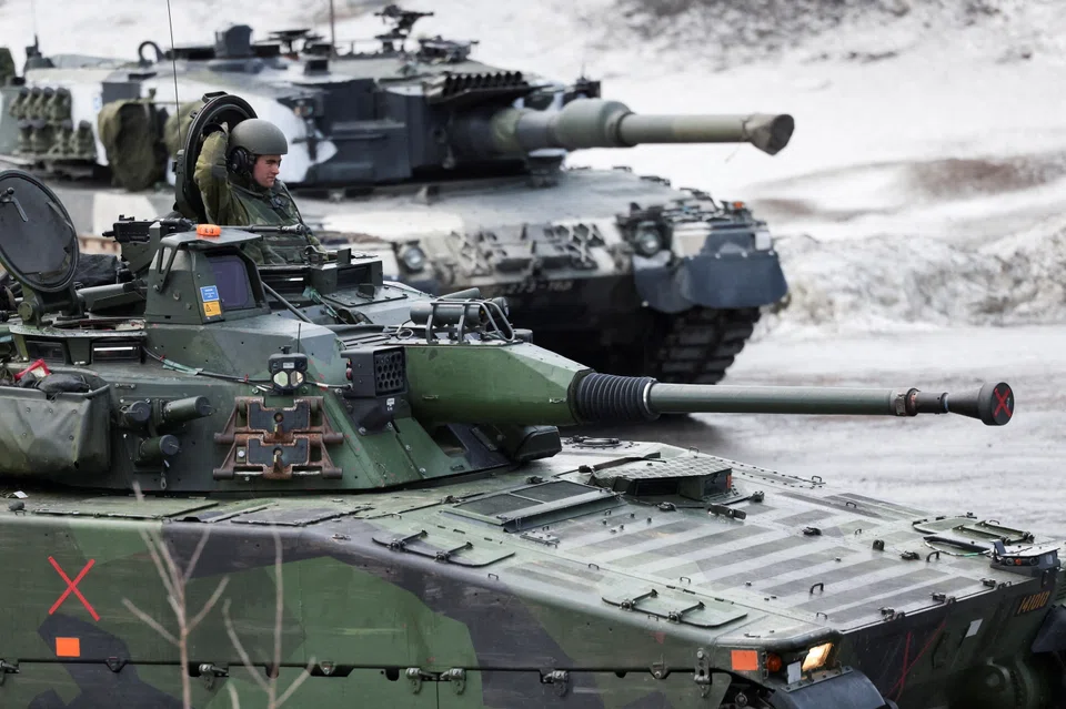 Swedish and Finnish tanks are seen during a military exercise called "Cold Response 2022", gathering around 30,000 troops from Nato member countries plus Finland and Sweden, amid Russia's invasion of Ukraine, Mar 22, 2022.
