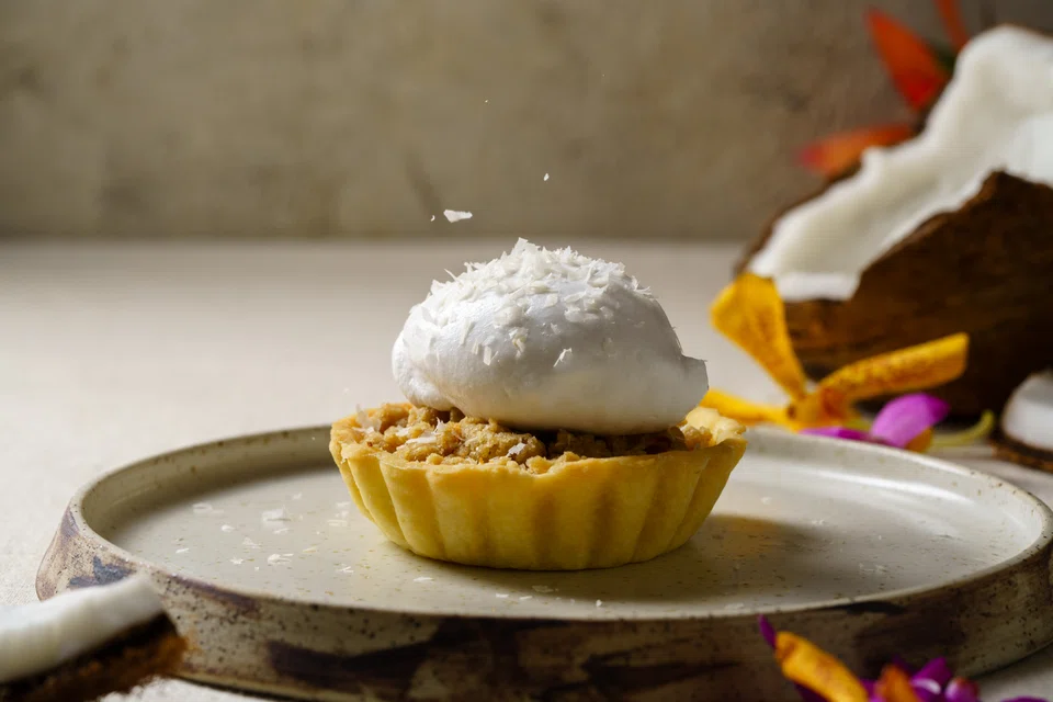 Crispy buko pie is filled with tender coconut flesh mixed in salty coconut cream.