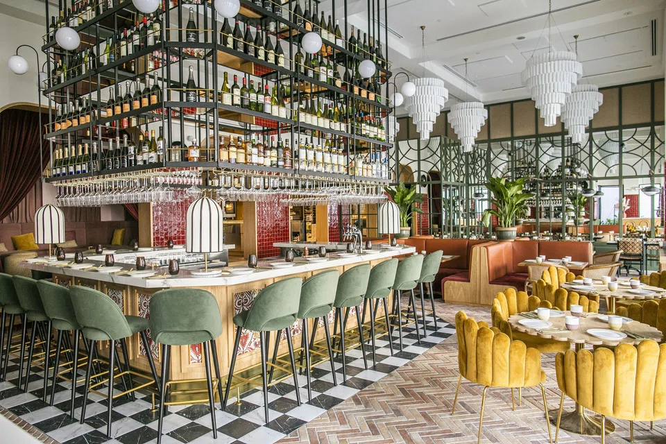 Noa's bar features ceiling-high shelves of alcohol. The restaurant has the novelty factor going for it.