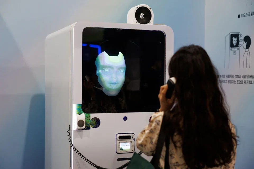 An attendee at the Seoul AI Robot Show in September interacting with an AI-powered robot consultant. Research shows that one in five AI projects in the Asia-Pacific fails, often because tools cannot be connected to existing systems and data.