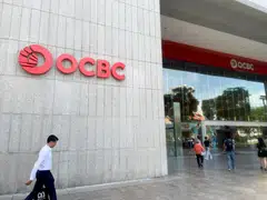 OCBC’s net profit is flat at S$1.98 billion for its third quarter, beating the S$1.79 billion consensus forecast in a Bloomberg survey.