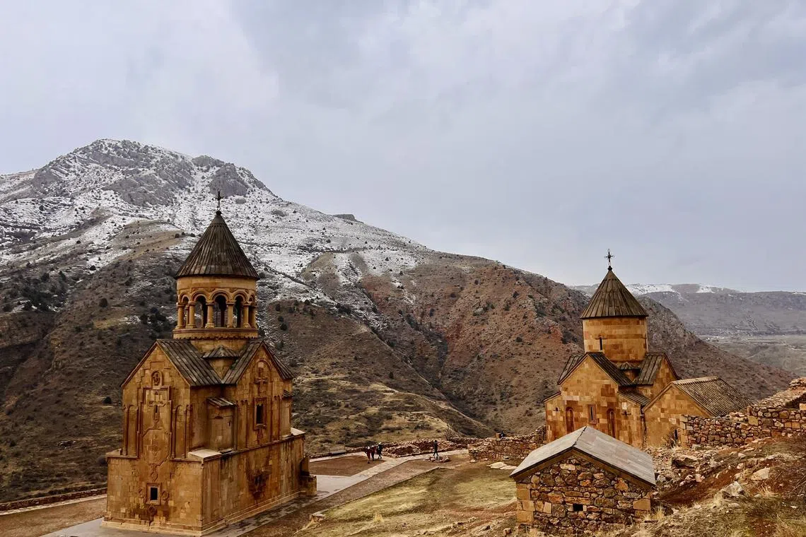 Noravank Monastery, built in the 13th century, is situated in a narrow gorge of the Amaghu River in Armenia. The churches’ conical roofs were added during a more recent restoration in the late 1990s.